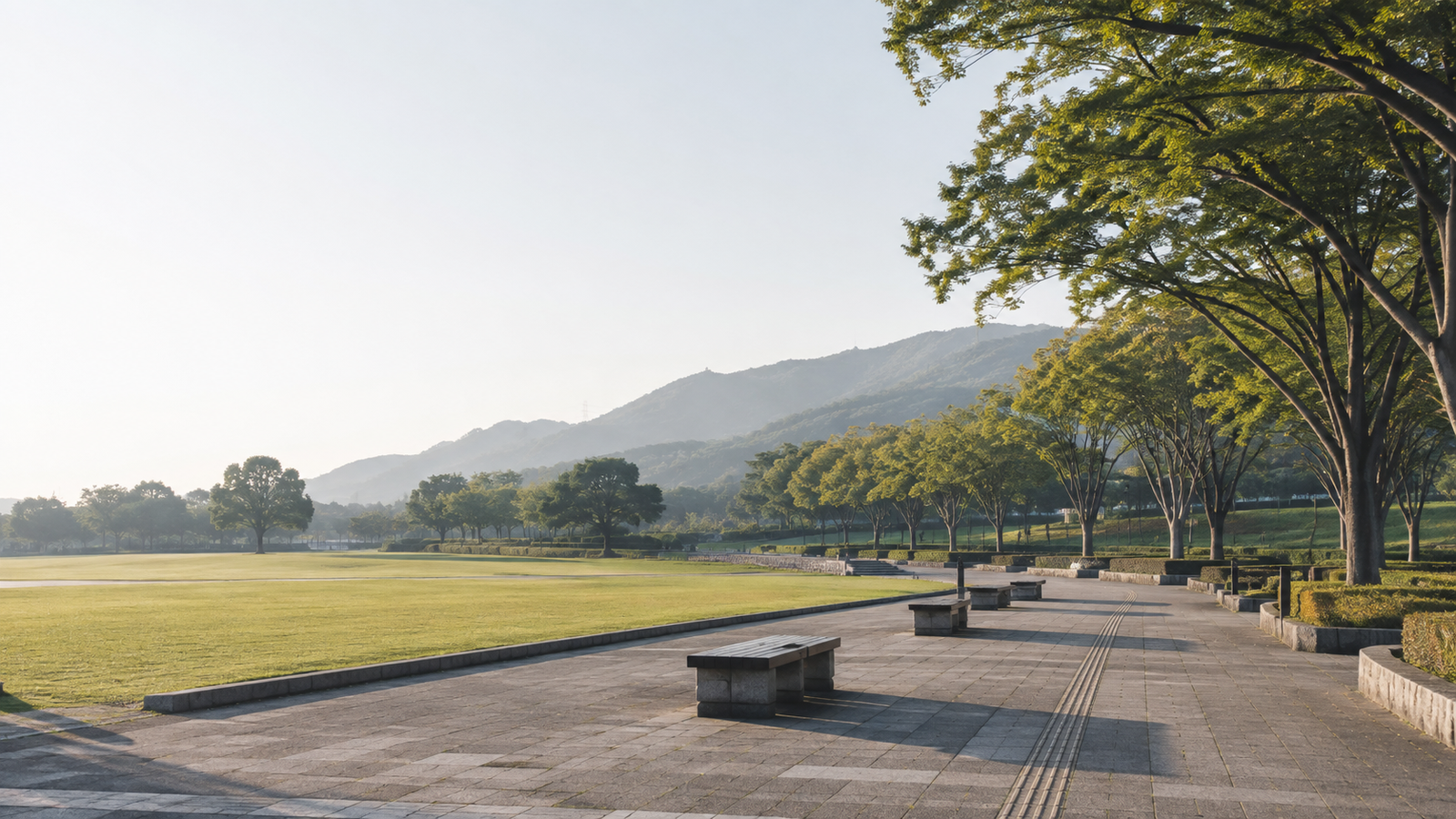 整備された公園の園路と並木のイメージ（AI生成）
